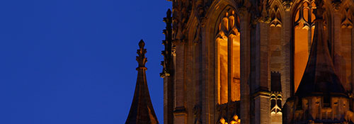 The historic Wills Memorial Building lit up against the night sky.